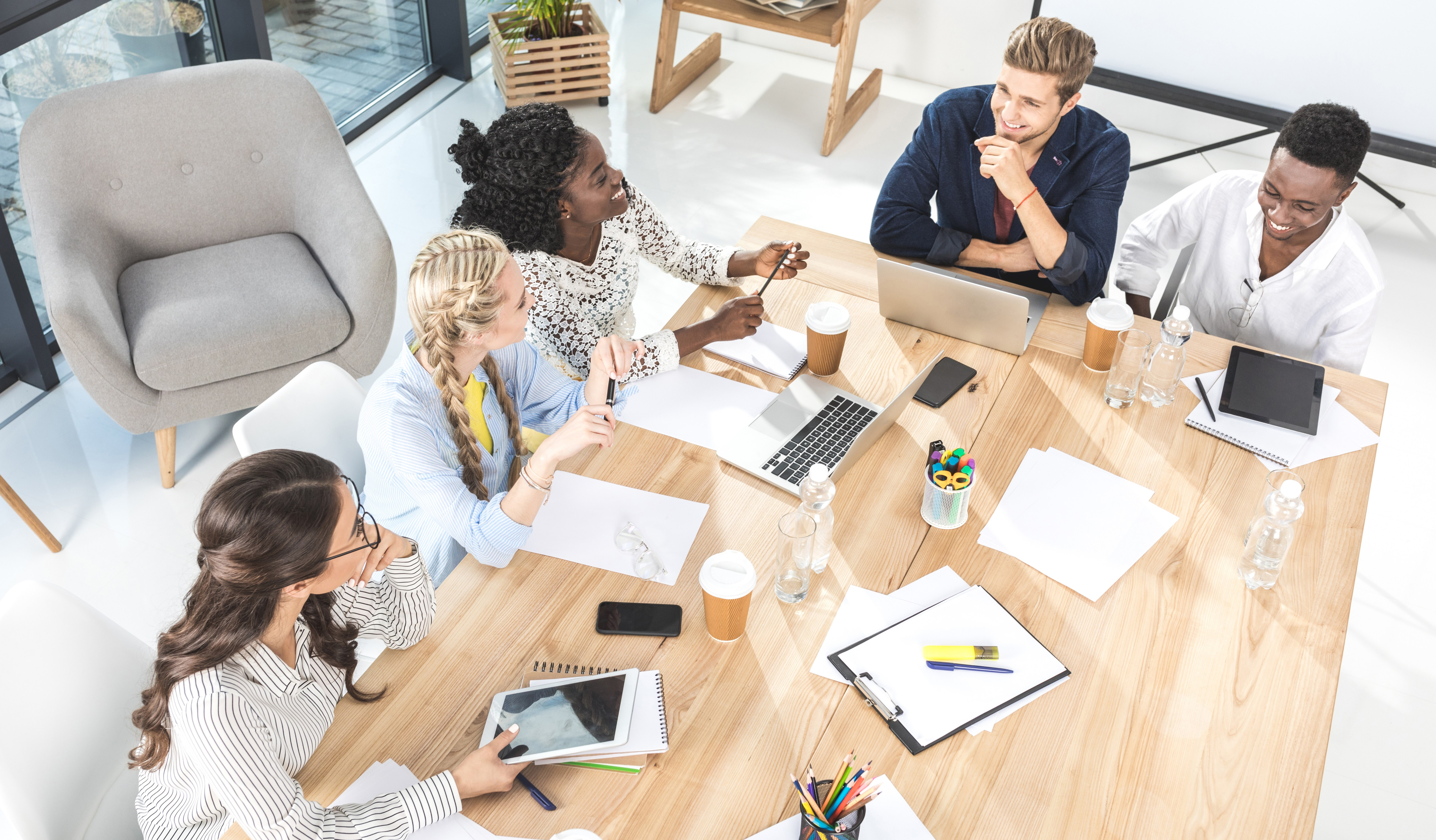 Multicultural business people discussing work